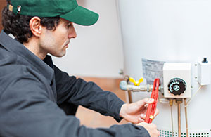 Wallace tech servicing water heater