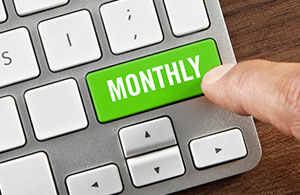 Green laptop button labeled monthly
